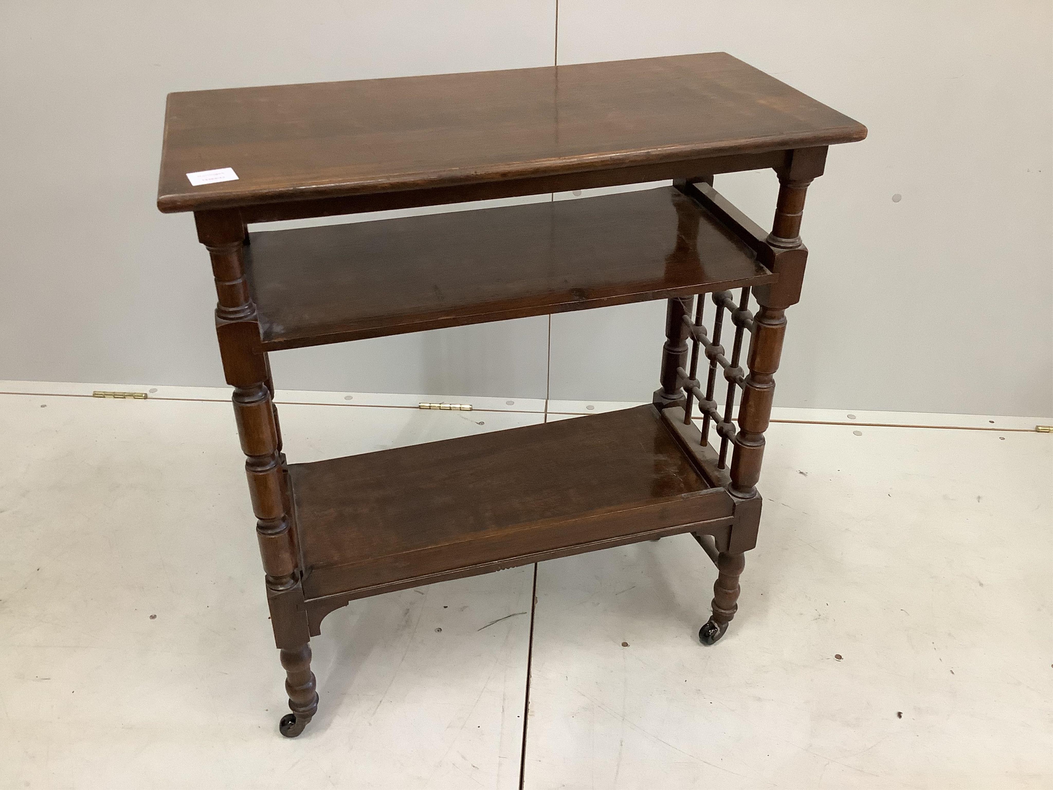 A Victorian oak three tier table, width 64cm, depth 28cm, height 77cm